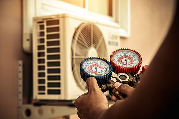 Professional Heat Pump Repair technician working in Wedgefield, FL